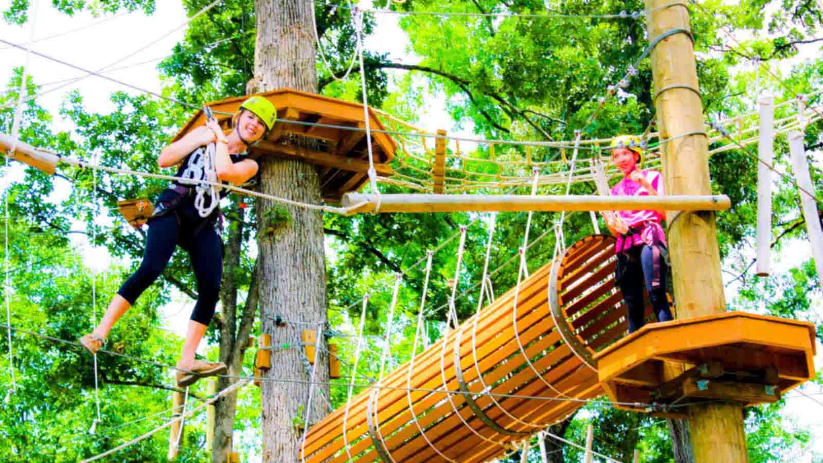 Adventure Designs builds adventure parks. Recreationsl family fun. Sky bridges, basket crawls, hanging nets, ziplines, and more